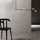 Modern black linear island pendant with glass shade dining room