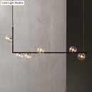Modern black linear island pendant with glass shade dining room