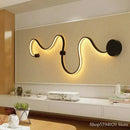 Modern black serpentine led wall sconce for living room decor