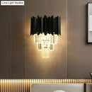 Modern black wall sconce with clear crystal prisms bedroom light