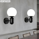 Modern black & white glass wall light – meeting room globe sconce