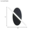 Modern black & white oval led sconce stairway light with warm glow