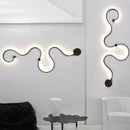Modern black & white sculptural wall lamps for bedroom decor