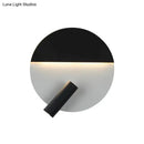 Modern black & white wall sconce with adjustable spotlight – bedroom