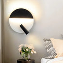Modern black & white wall sconce with adjustable spotlight – bedroom