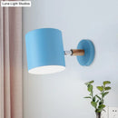 Modern blue metal tubular wall lamp with wood arm bedroom sconce light