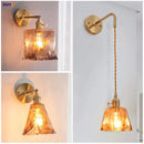 Modern brass and amber glass wall lamp for bedroom living room