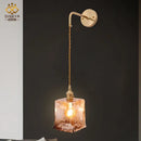 Modern brass and amber glass wall lamp for bedroom living room