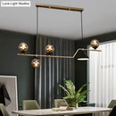 Modern brass and black 3 light hanging island light for dining room