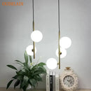 Modern brass and black glass ball pendant light dining room