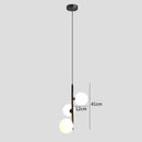 Modern brass and black glass ball pendant light dining room