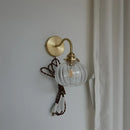 Modern brass and blue glass ball wall sconce with pull chain bedroom