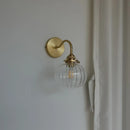 Modern brass and blue glass ball wall sconce with pull chain bedroom