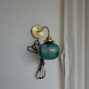 Modern brass and blue glass ball wall sconce with pull chain bedroom