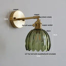Modern brass and clear glass wall lights – bedroom rotating sconce