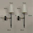 Modern brass and cream fabric led wall lamps for bedroom