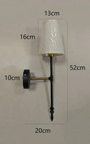 Modern brass and cream fabric led wall lamps for bedroom