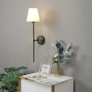 Modern brass and cream fabric led wall lamps for bedroom