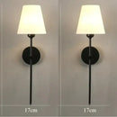 Modern brass and cream fabric led wall lamps for bedroom