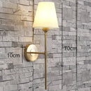 Modern brass and cream fabric led wall lamps for bedroom