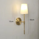 Modern brass and cream fabric led wall lamps for bedroom