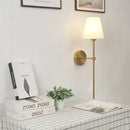 Modern brass and cream fabric led wall lamps for bedroom