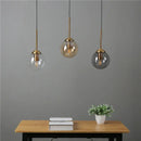 Modern brass and glass pendant lights for kitchen dining room