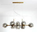 Modern brass and gray glass pendant lights for kitchen dining room
