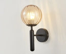 Modern brass and pink glass wall sconce for bedroom