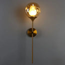 Modern brass and smoke gray glass wall light bedroom sconce