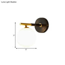 Modern brass and white glass wall sconce – bedroom globe light