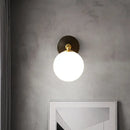 Modern brass and white glass wall sconce – bedroom globe light