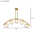 Modern brass arch arm 5-light pendant – dining room glass orb light