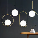 Modern brass & black glass ball pendant light dining room