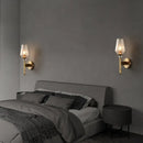 Modern brass diamond wall light with lattice glass shade bedroom