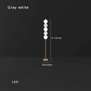 Modern brass floor lamp with six spheres for living room decor