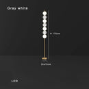 Modern brass floor lamp with six spheres for living room decor