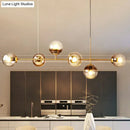 Modern brass glass ball linear pendant light for dining room