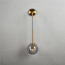 Modern brass glass ball wall lamp bedroom amber globe lighting