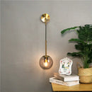 Modern brass glass ball wall lamp bedroom amber globe lighting