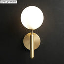 Modern brass glass globe wall mount light living room sconce
