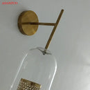 Modern brass glass wall lamp bedroom perforated gold sconce