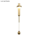 Modern brass l-shaped wall sconce with pull chain for living room
