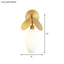 Modern brass leaf wall lamp with cream glass bedroom sconce