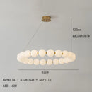 Modern brass led pendant light with frosted spheres for living room