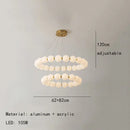 Modern brass led pendant light with frosted spheres for living room