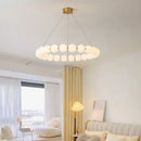 Modern brass led pendant light with frosted spheres for living room