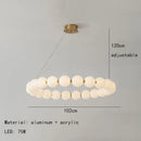 Modern brass led pendant light with frosted spheres for living room