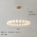 Modern brass led pendant light with frosted spheres for living room