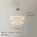 Modern brass led pendant light with frosted spheres for living room